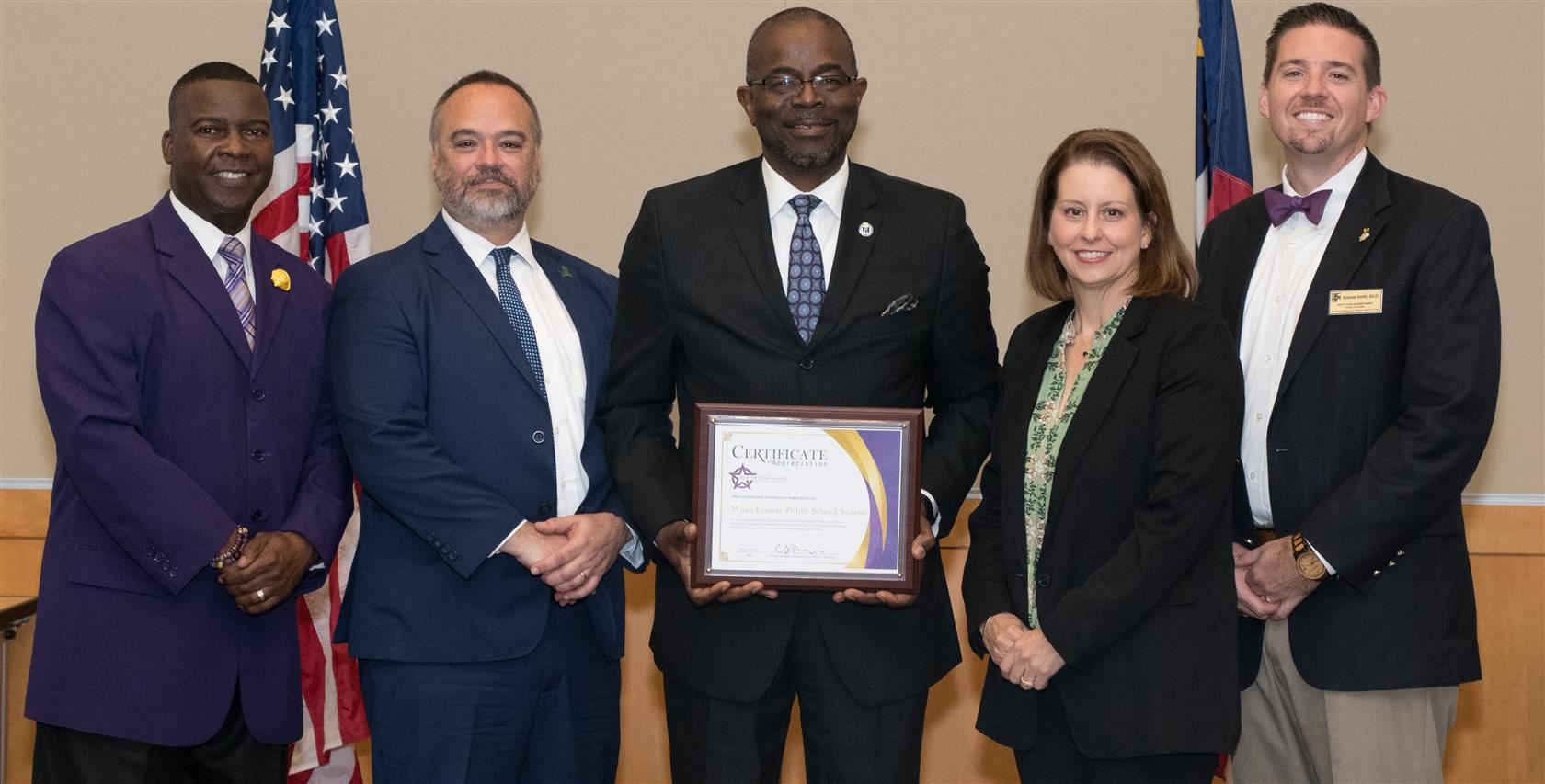 Dr. Taylor accepts Purple Star Award along with other dignitaries 